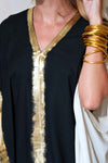 Close up of kaftan showing its relaxed, flowing silhouette and natural drape.