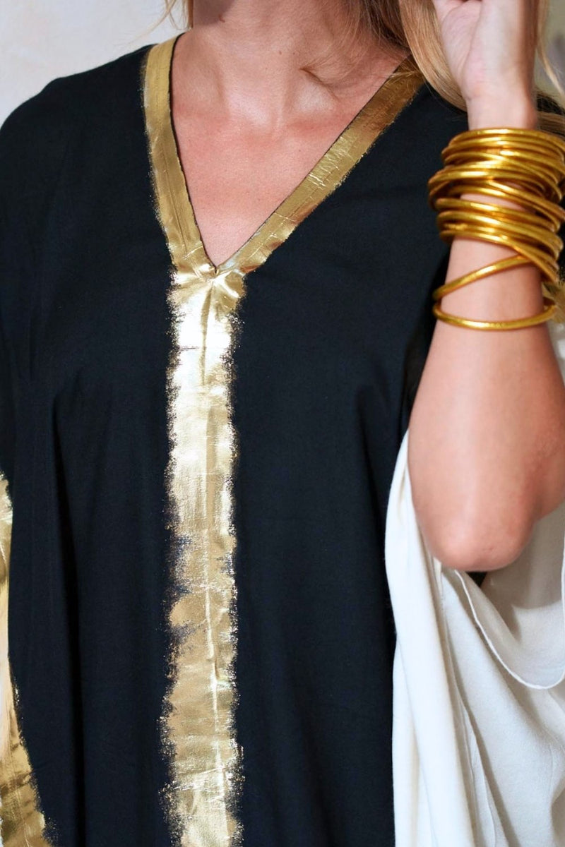 Close up of kaftan showing its relaxed, flowing silhouette and natural drape.