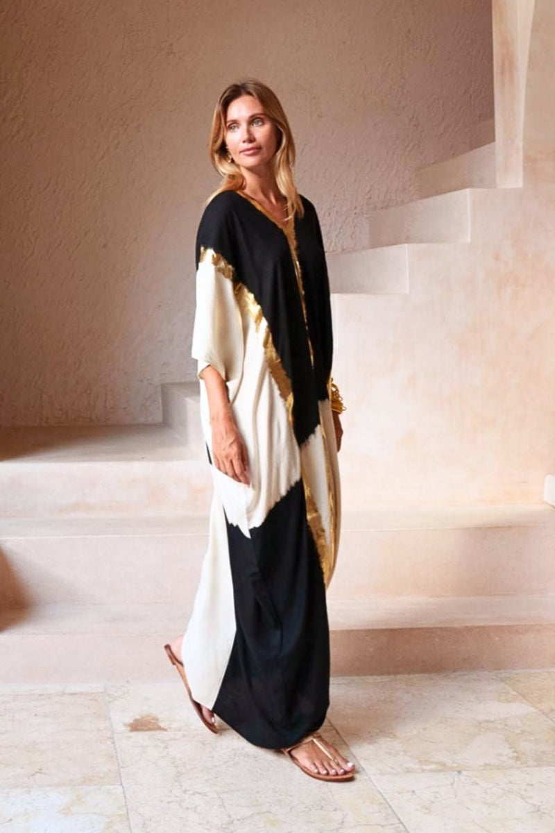 Side view of the kaftan showing its relaxed, flowing silhouette and natural drape.