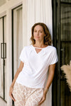 Ashleigh Top in white styled with denim. Eco-friendly, breathable modal fabric and shoulder coverage design.
