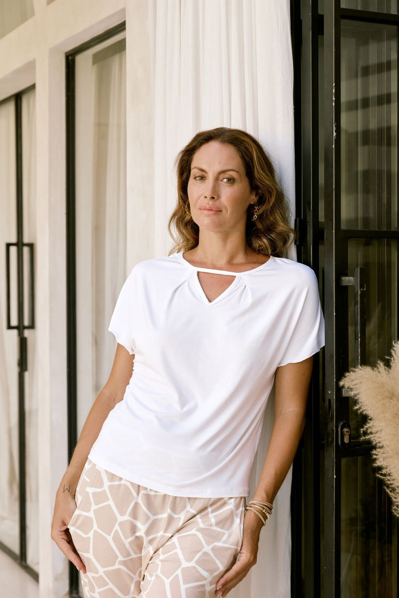 Ashleigh Top in white styled with denim. Eco-friendly, breathable modal fabric and shoulder coverage design.