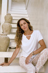 Ashleigh Top in white. Sustainable modal fabric with flattering V-neck and relaxed fit.