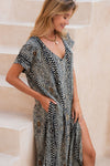 African art inspired black and white linen kaftan with zebra-like design.