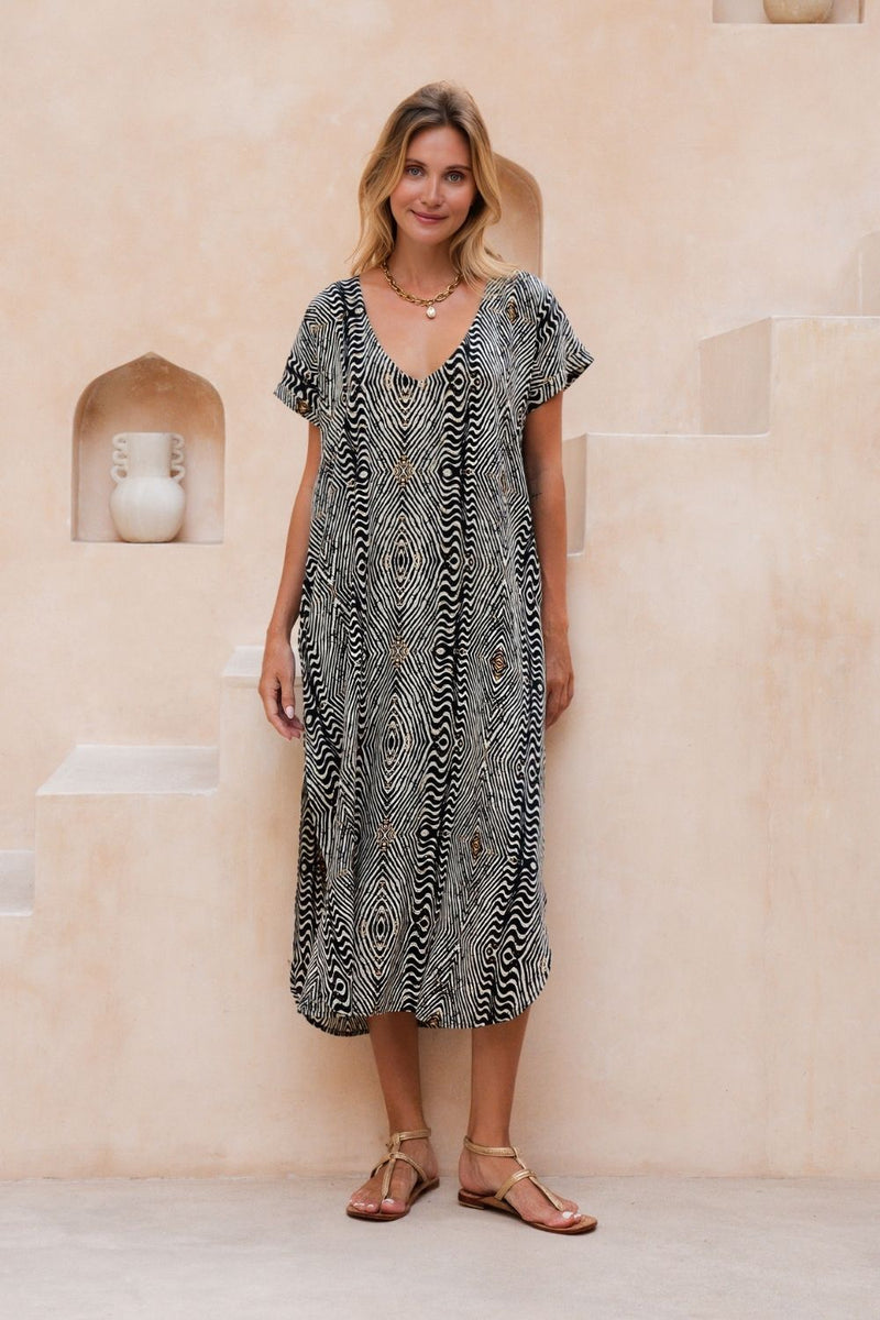 Long linen kaftan in black and white abstract print with soft V neck and capped sleeves.