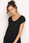 Black Nieve Top featuring waist-length fit and sparkling sequin pocket. Australian made from breathable, eco-friendly modal.