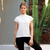 Front view of White Taylor Turtle Neck showing short sleeves and mock neckline. Relaxed fit made from natural sustainable modal.